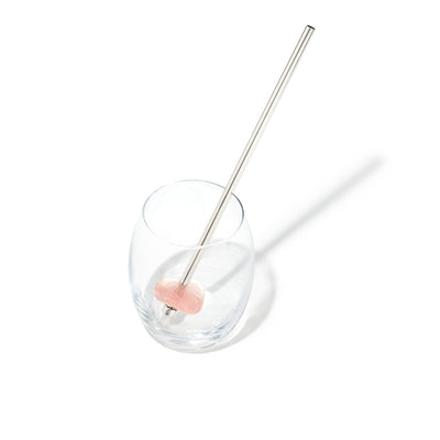 ROSE QUARTZ Crystal Straw - Silver Finish by Crystals for Humanity shown in a Drinking Glass